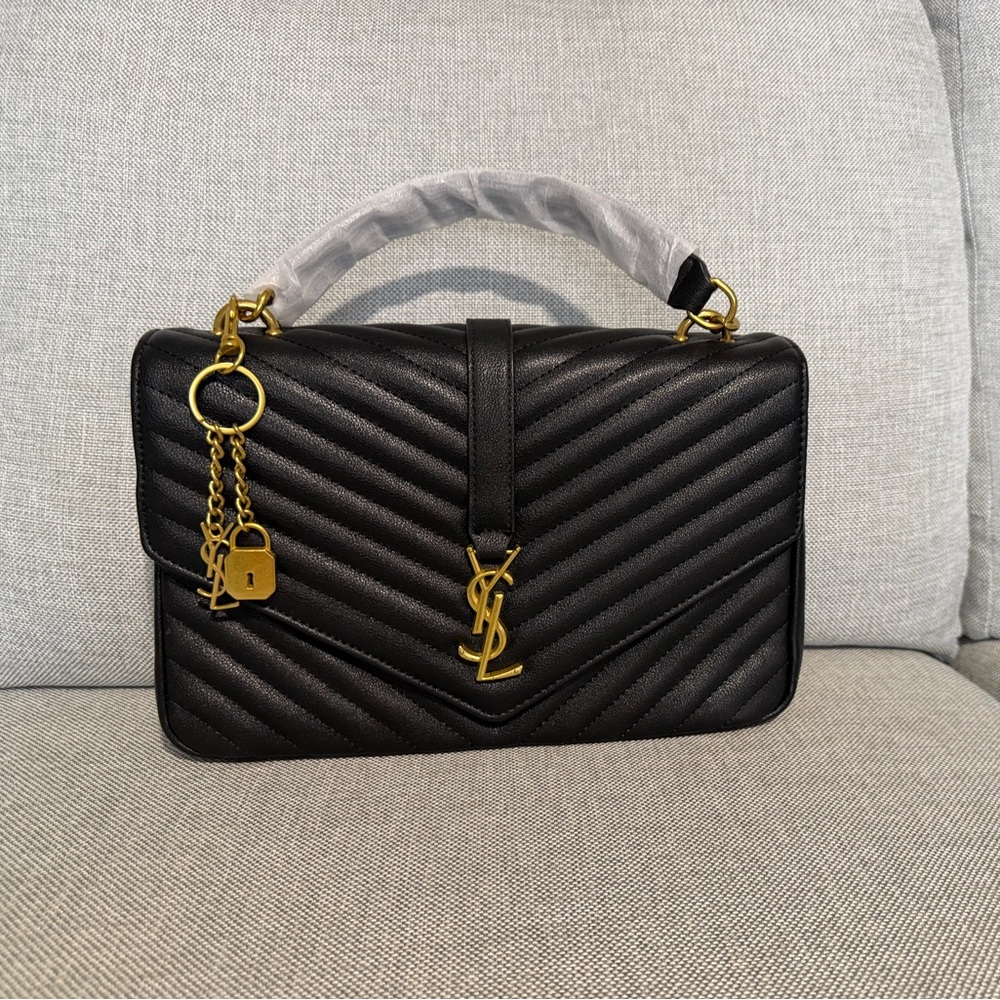 Black Quilted  Top-Handle Bag with Gold Hardware.